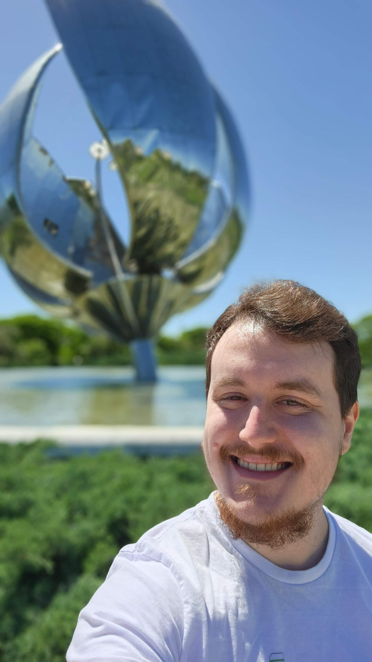 It's me! A selfie of me from November 2023 in front of the Floralis Generica sculpture in Buenos Aires, Argentina